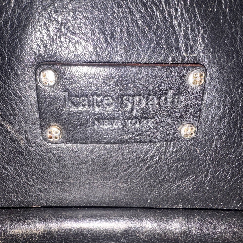 Kate Spade New York Black Leather Tote. Polka dot lining turn lock pocket.